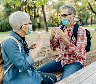 Man-talking-to-senior-woman